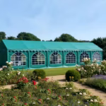 6m x 12m green PVC Marquee with steel frame, ground bars and gable uprights