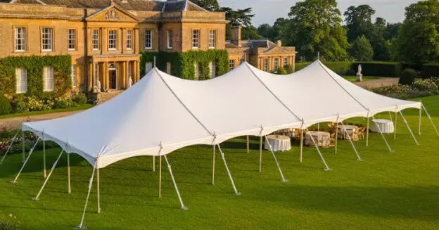 9m x 24m traditional marquee white pvc in a manor house garden
