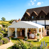 6x4m 650gsm PVC Premium Marquee in a summer garden