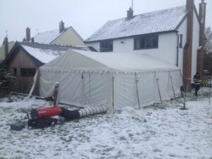Snowy Marquee attached to a building