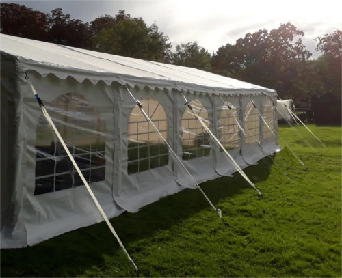 Marquee with stakes and ratchet on every leg